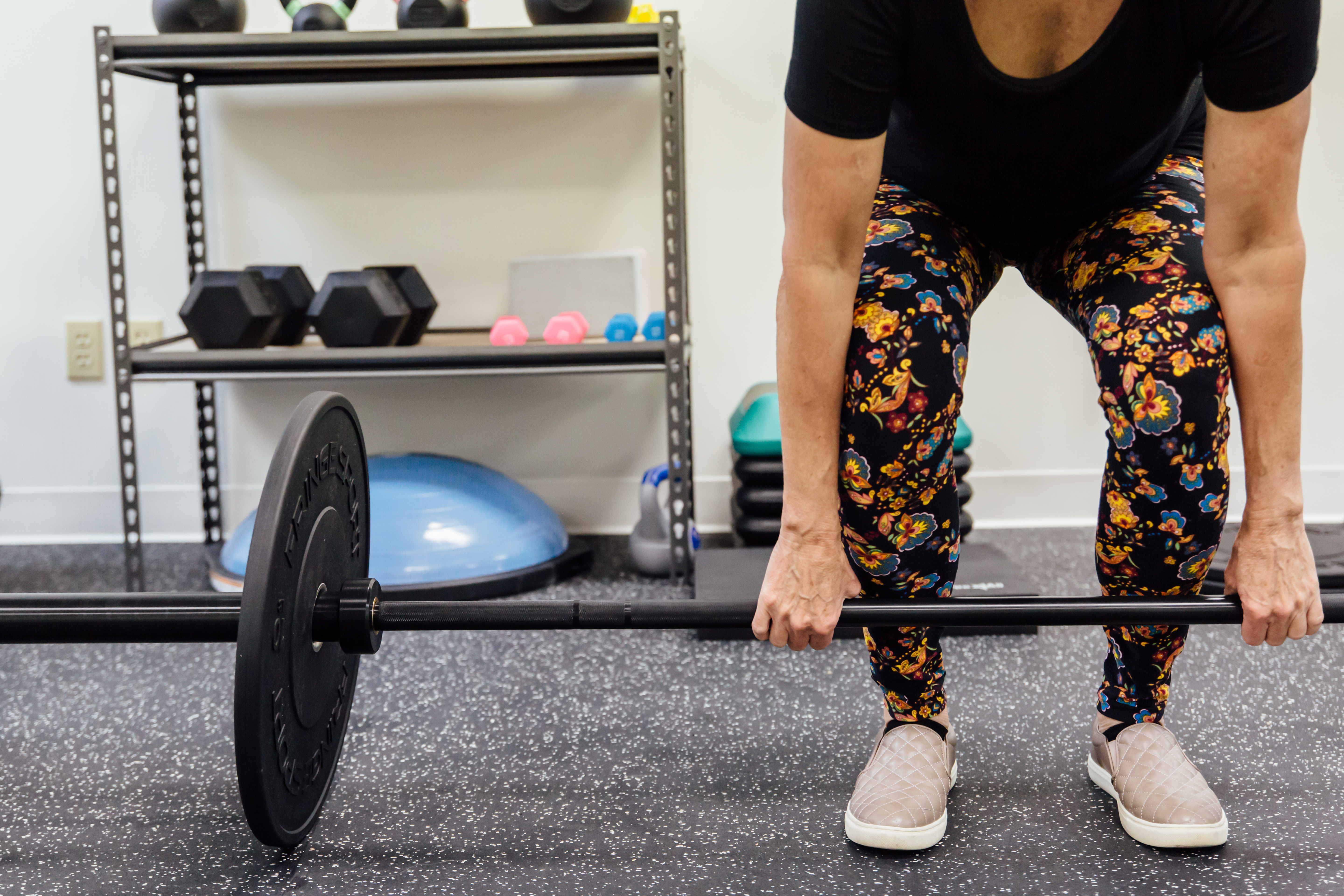 Female athlete lifting weights with confidence